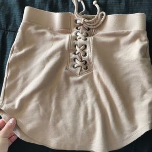 Nude color mini skirt